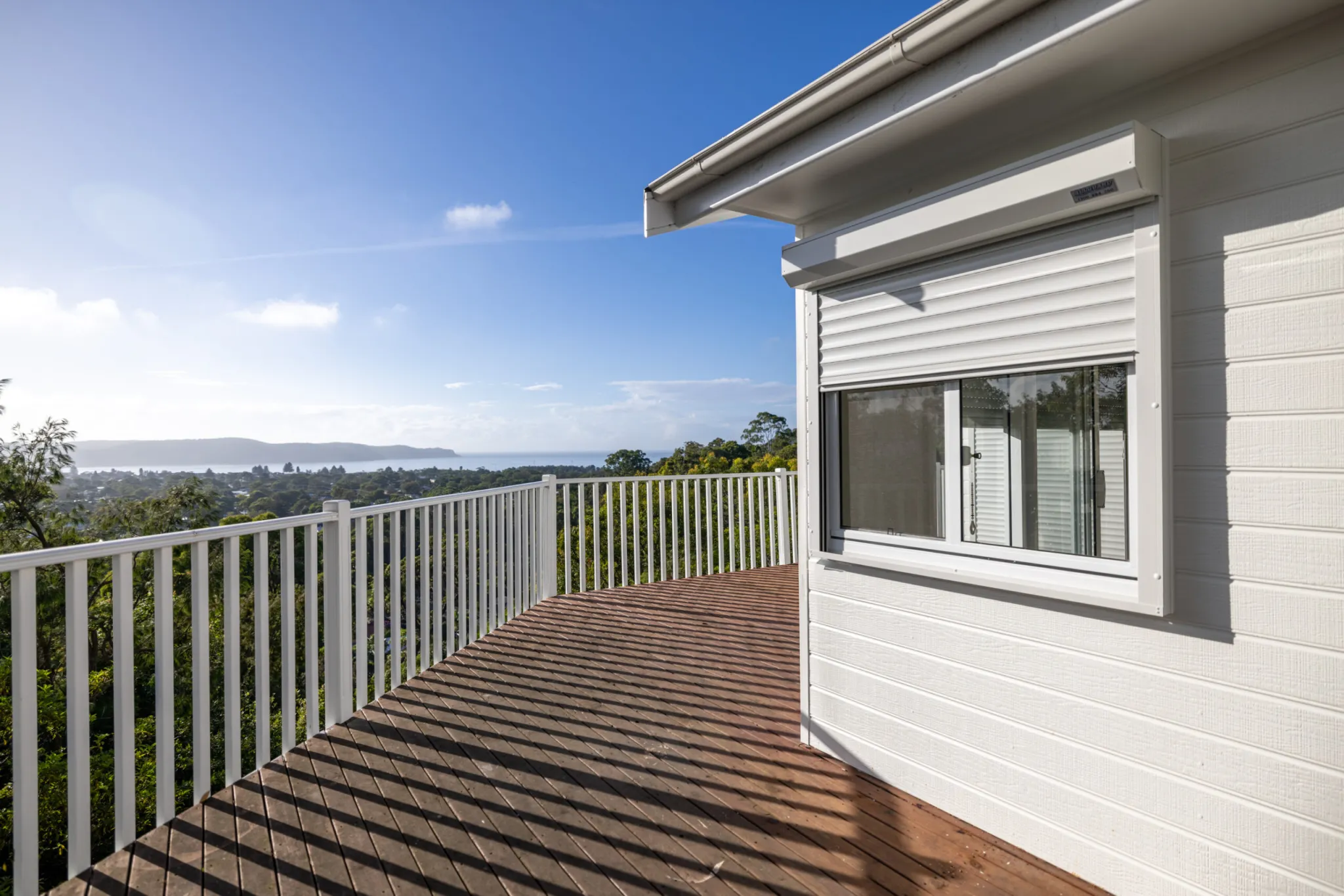 Balcony ocean view with shutters