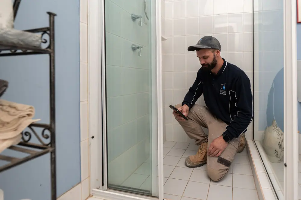 Inspecting a shower after regrouting
