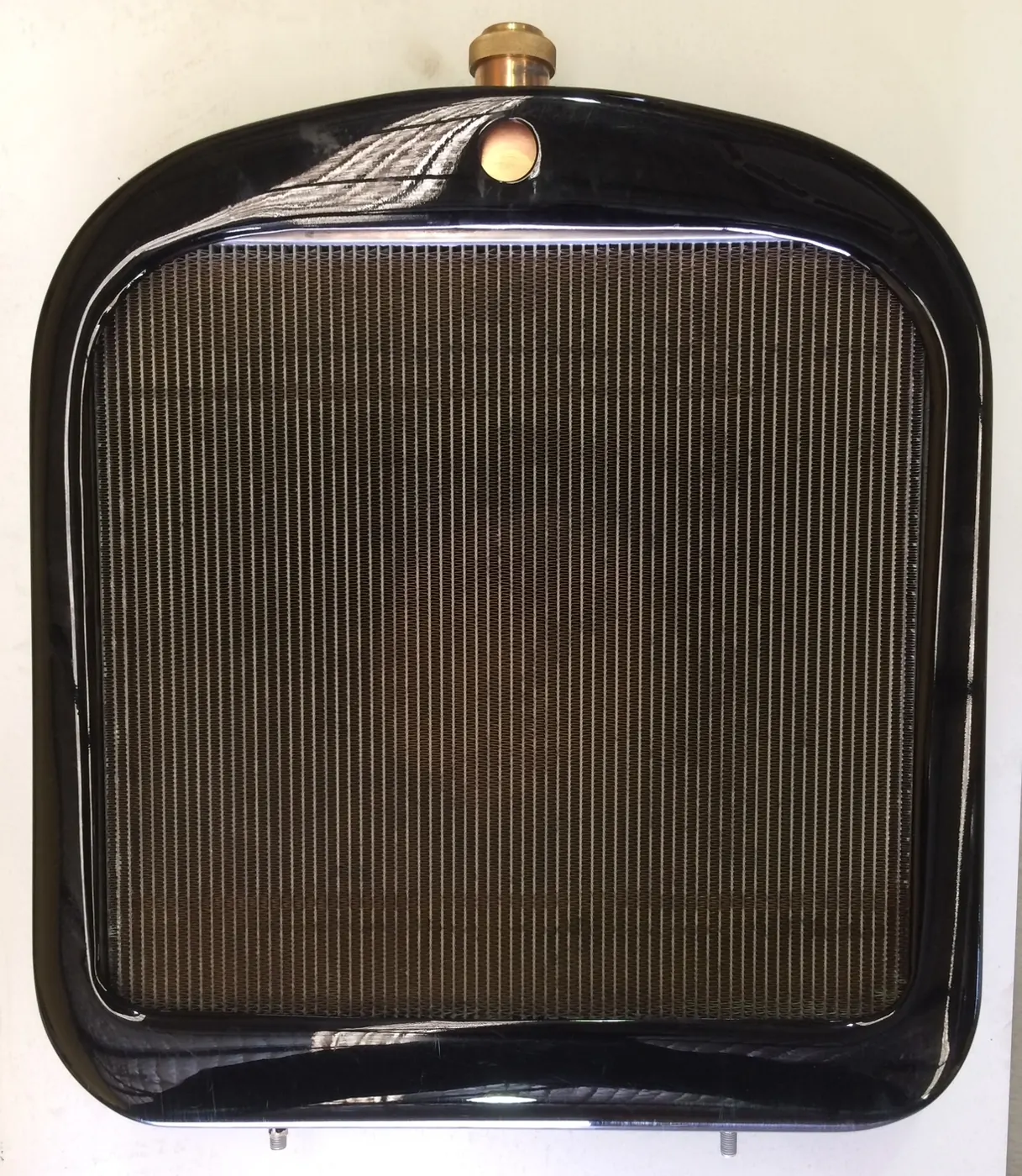 Restored vintage radiator with a new copper core in its original black shell